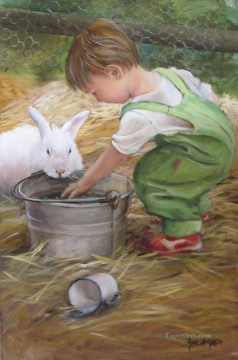 動物 Painting - ウサギのペットの子供を持つ少年